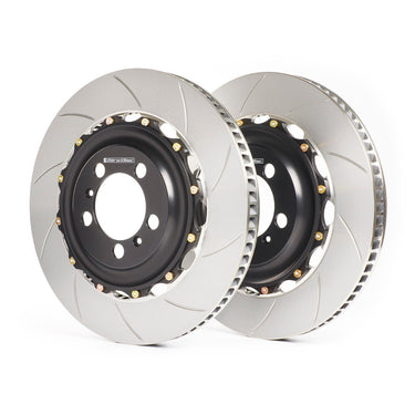 Two brake rotors on a white background